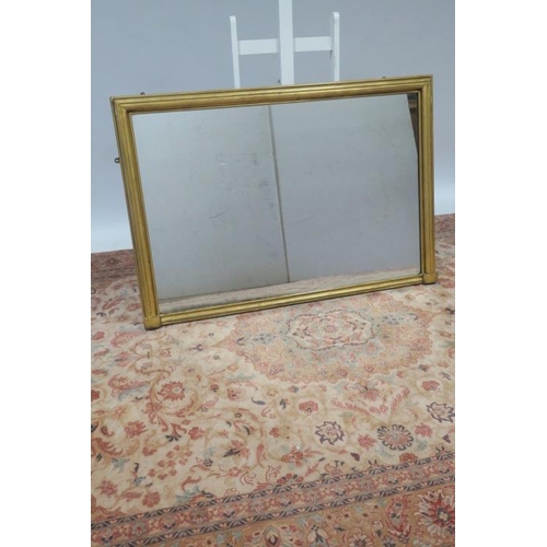 724 - A 19TH CENTURY GILTWOOD OVERMANTLE MIRROR the rectangular plate within a pilaster moulded frame 
104... 