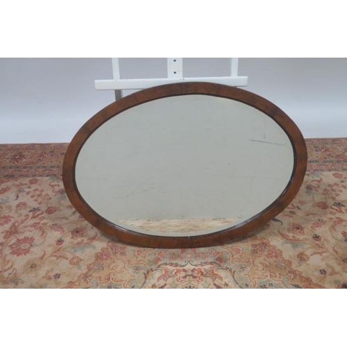 725 - TWO VINTAGE MAHOGANY FRAMED MIRRORS each of oval outline together with A VINTAGE GILT FRAME MIRROR o... 