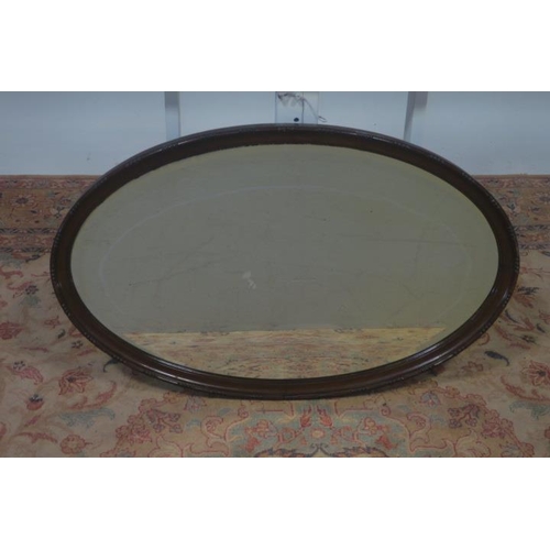 725 - TWO VINTAGE MAHOGANY FRAMED MIRRORS each of oval outline together with A VINTAGE GILT FRAME MIRROR o... 