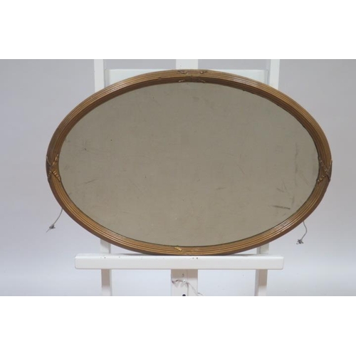 725 - TWO VINTAGE MAHOGANY FRAMED MIRRORS each of oval outline together with A VINTAGE GILT FRAME MIRROR o... 