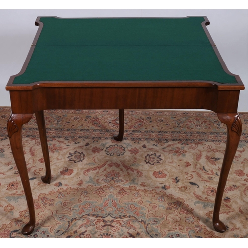 79 - A GEORGIAN DESIGN MAHOGANY FOLDOVER CARD TABLE the rectangular hinged top with eared corners above a... 