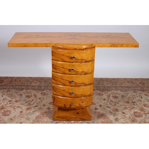 92 - AN ART DECO DESIGN WALNUT CONSOLE TABLE of rectangular outline the shaped top above five long demi l... 