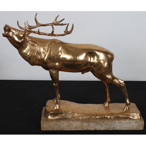 107 - after HERBERT JAHN
A CAST GILT METAL FIGURE modelled as an elk shown standing on a naturalistic base... 