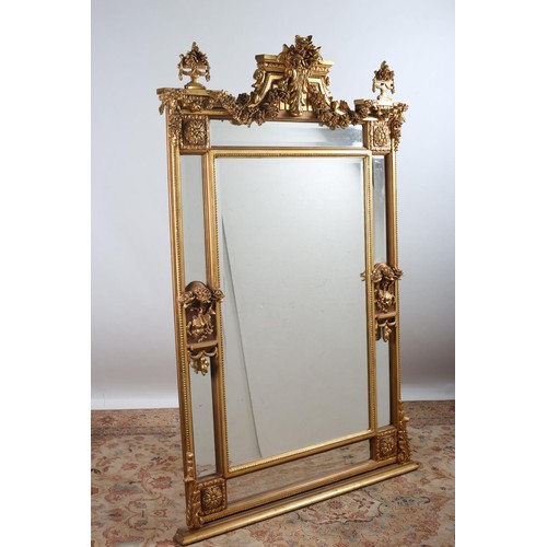 170 - A CONTINENTAL GILT FRAME COMPARTMENTED OVERMANTLE MIRROR the rectangular bevelled glass plate within... 