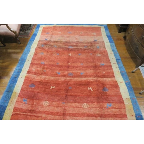 175 - A GABBEH WOOL RUG the light pink striped shaded ground with central panel with stylised foliage and ... 