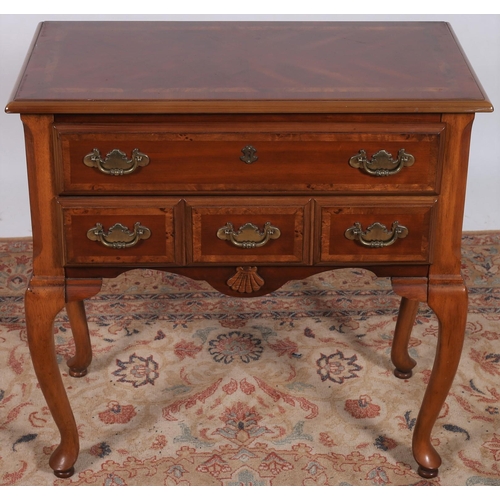 251 - A QUEEN ANNE DESIGN KINGWOOD LOW BOY of rectangular outline the shaped top above two long drawers wi... 