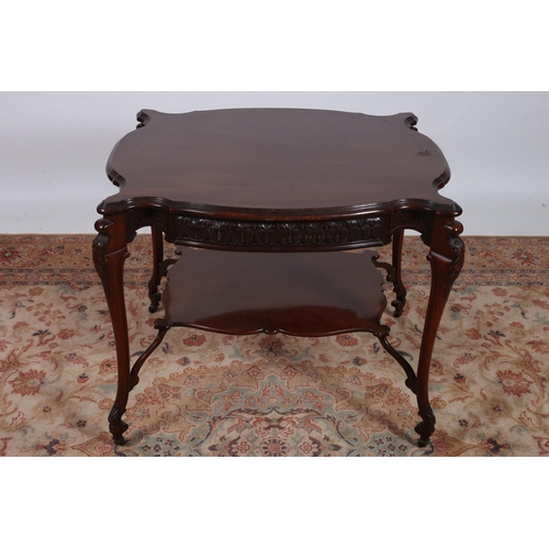 257 - AN EDWARDIAN CARVED MAHOGANY CENTRE TABLE of serpentine outline the shaped top above a carved apron ... 