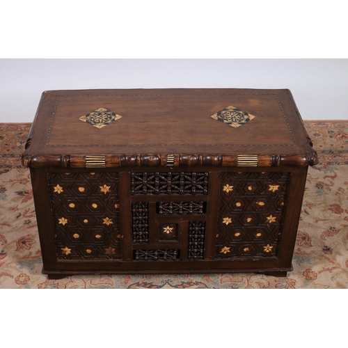 300 - AN ORIENTAL HARDWOOD TRUNK of rectangular outline the hinged lid with inlaid panels containing a lid... 