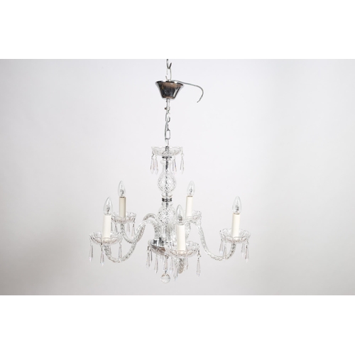 363 - A CONTINENTAL CUT GLASS FIVE BRANCH CHANDELIER the baluster column above a dish under tier issuing f... 