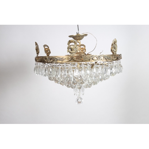 365 - A CONTINENTAL GILT BRASS AND CUT GLASS SEVEN TIER GRADUATED CHANDELIER hung with pendant drops
60cm ... 