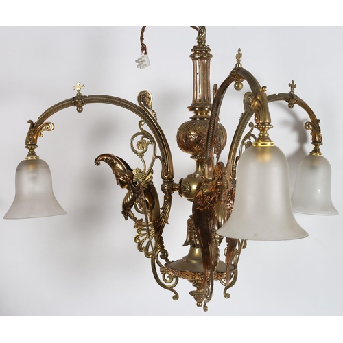 370 - A 19TH CENTURY VINTAGE BRASS THREE BRANCH CENTRE LIGHT the baluster column issuing three pierced fol... 