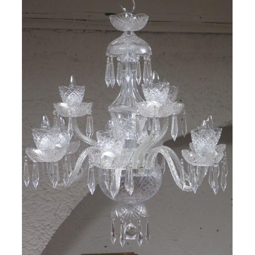 374 - A TARA CRYSTAL CUT GLASS NINE BRANCH CHANDELIER in two registers hung with faceted pendants (a match... 