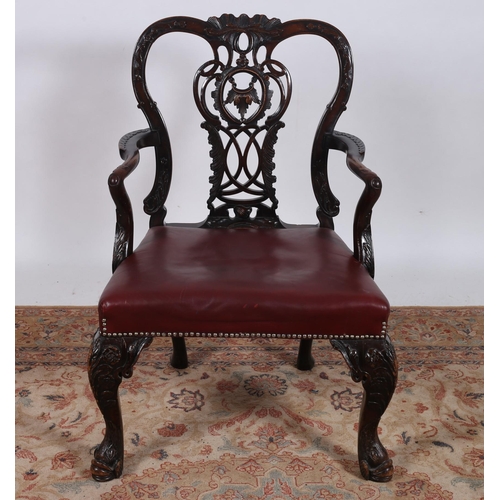 271 - A GEORGIAN DESIGN IRISH MAHOGANY ELBOW CHAIR the carved top rail above a pierced and carved splat wi... 