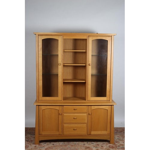 832 - A BEECHWOOD DRESSER of rectangular outline the shaped top above four open shelves flanked on each si... 