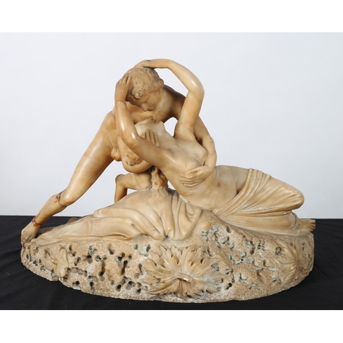 120 - A 19TH CENTURY ALABASTER GROUP modelled as a female and her companion shown embracing on a carved fo... 