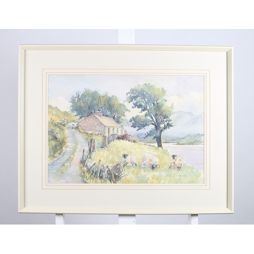 144 - BETTY MCCORMACK 
Mountain Scene with Cottage and Sheep
Watercolour
Signed lower right 
37cm (h) x 54... 