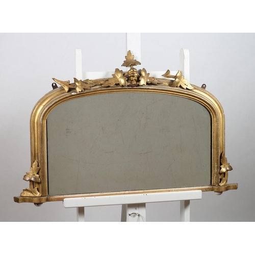 158 - A 19TH CENTURY GILTWOOD OVERMANTLE MIRROR the rectangular arched plate within a moulded frame with f... 