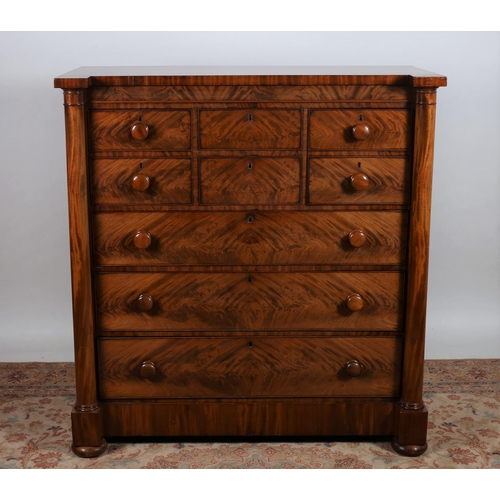 187 - A GOOD 19TH CENTURY MAHOGANY SCOTCH CHEST of inverted breakfront outline the shaped top above two de... 