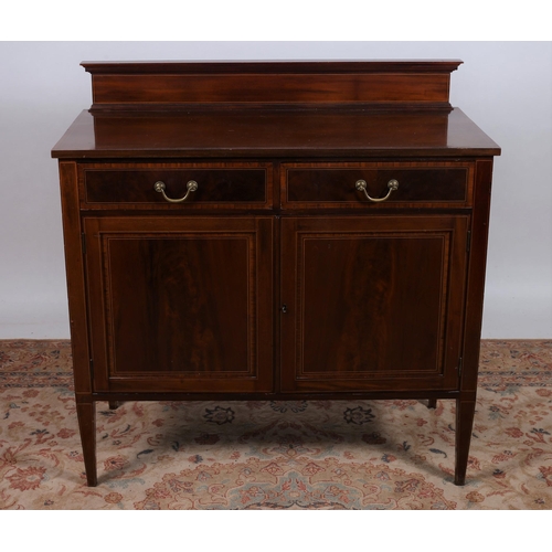 188 - AN EDWARDIAN MAHOGANY AND KINGWOOD CROSSBANDED SIDE CABINET of rectangular outline the shaped top wi... 