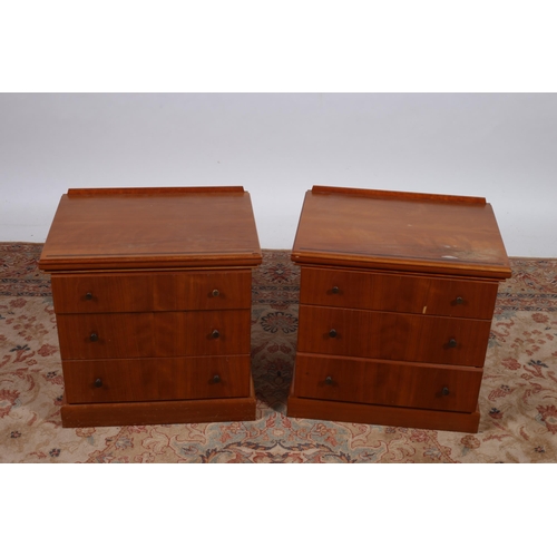 208 - A PAIR OF CHERRYWOOD BEDSIDE CHESTS each of rectangular outline the shaped top with moulded back abo... 