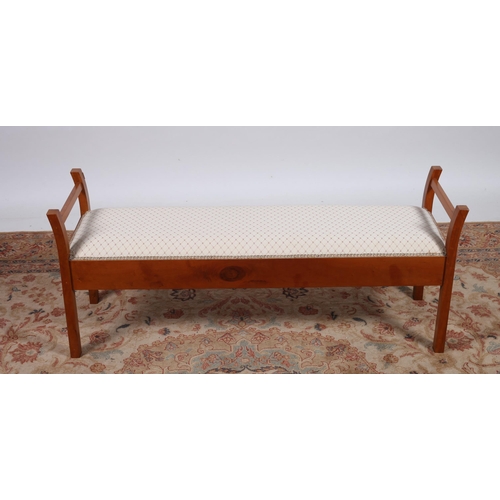 210 - A CHERRYWOOD DRESSING STOOL of rectangular outline the upholstered seat above a moulded apron on squ... 