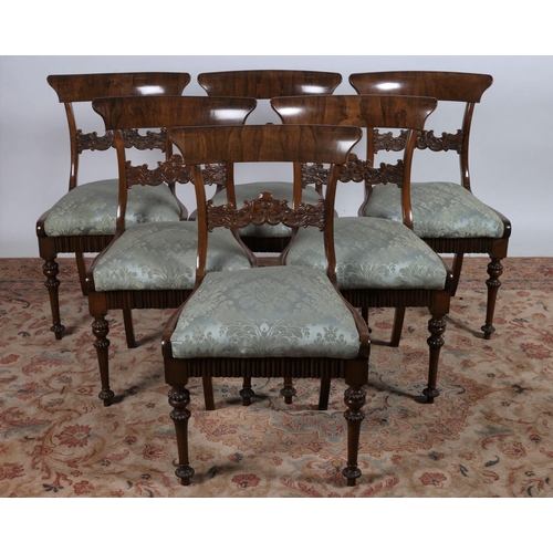 214 - A FINE SET OF SIX REGENCY ROSEWOOD DINING CHAIRS each with a curved top rail and carved splat with u... 