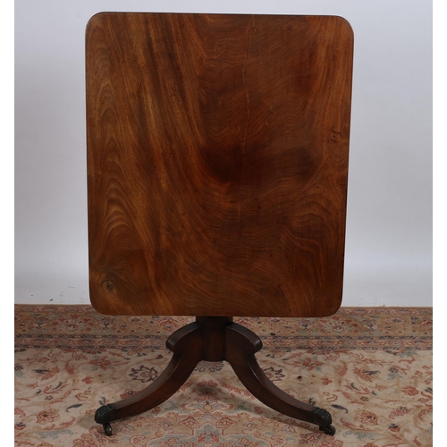 222 - A GEORGIAN MAHOGANY POD TABLE of rectangular outline the shaped top with rounded corners above a bal... 