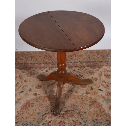 231 - A 19TH CENTURY MAHOGANY POD TABLE of circular outline the shaped top above a baluster column with sp... 