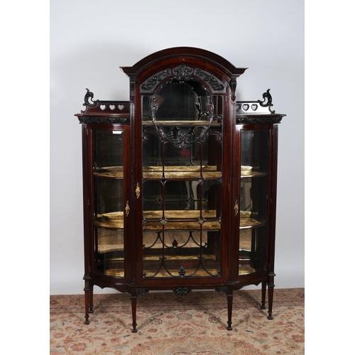 236 - AN EDWARDIAN MAHOGANY CHINA DISPLAY CABINET of rectangular bowed outline the arched cornice above a ... 