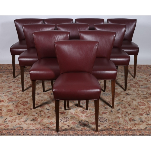 237 - A FINE SET OF TEN DESIGNER RED HIDE AND STAINED WOOD DINING CHAIRS each with a shaped upholstered ba... 