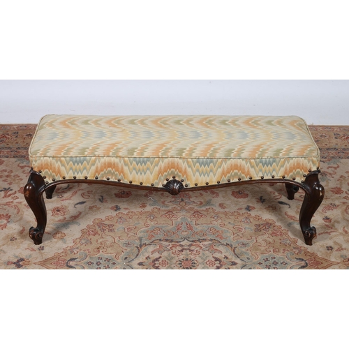 241 - A 19TH CENTURY MAHOGANY AND UPHOLSTERED STOOL of rectangular outline the upholstered seat with shell... 