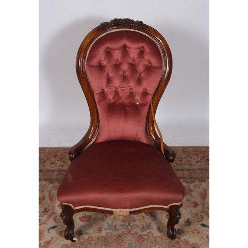 242 - A 19TH CENTURY MAHOGANY AND UPHOLSTERED LADIES CHAIR the foliate carved top rail above a buttoned up... 