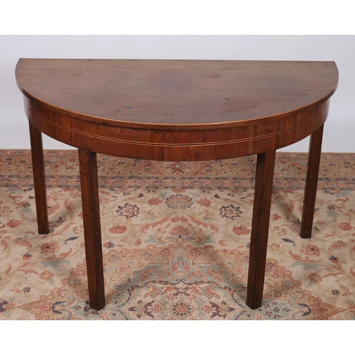 263 - A GEORIGAN MAHOGANY INLAID SIDE TABLE of demi lune outline the shaped top above a moulded apron on s... 