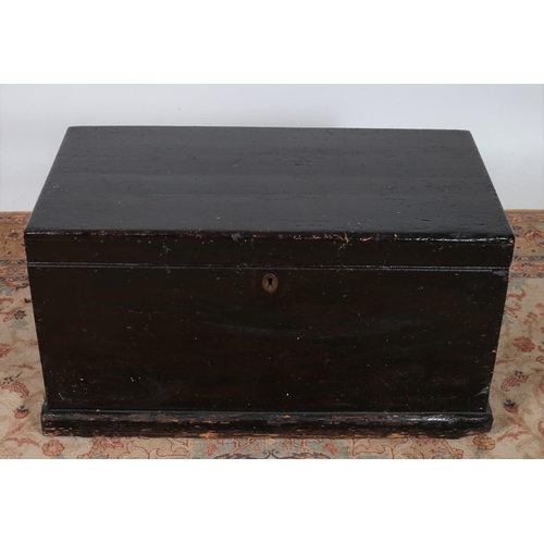 266 - A VINTAGE STAINED PINE TRUNK of rectangular form the hinged lid containing a lidded compartment and ... 