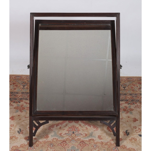 267 - A 19TH CENTURY MAHOGANY CRUTCH FRAME MIRROR the reeded frame containing a plate glass mirror on shap... 