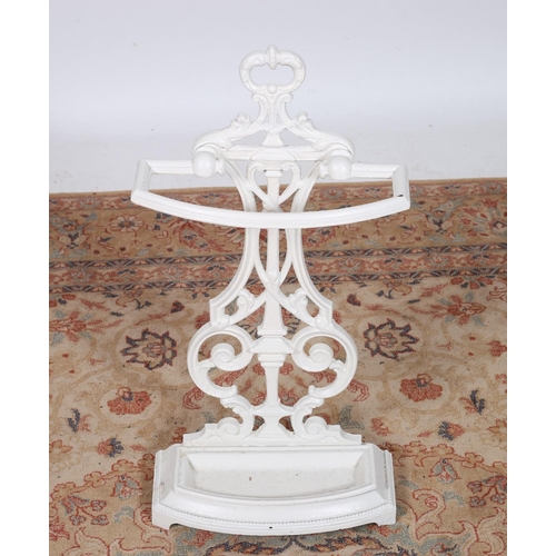 269 - A CAST IRON STICK STAND the pierce C-scroll back plate above a demi lune base with drip pan 
69cm (h... 