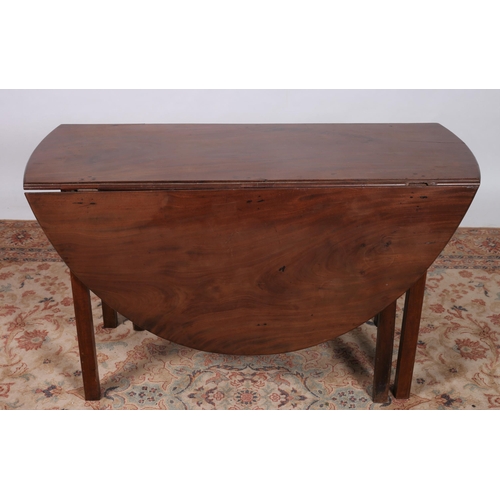 276 - A GEORGIAN MAHOGANY DROP LEAF TABLE of oval outline the shaped top with hinged leaves raised on squa... 