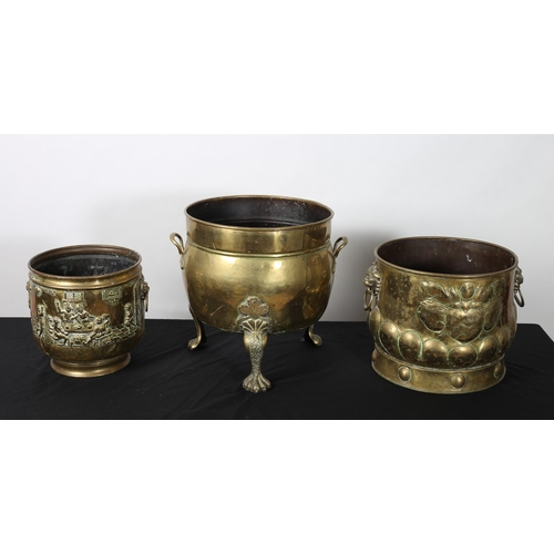 281 - A BRASS JARDINIERE of cylindrical form raised on claw supports with carrying handles together with A... 