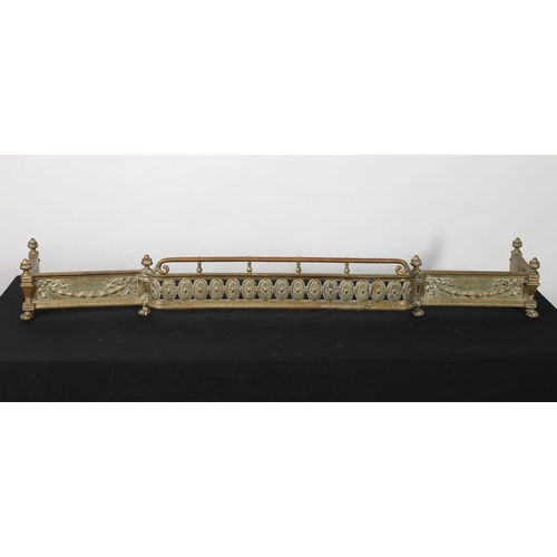 293 - A 19TH CENTURY CAST BRASS FENDER of rectangular breakfront outline the cylindrical top rail above a ... 