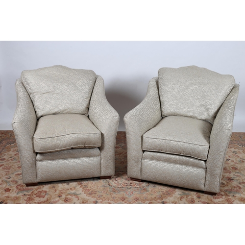 296 - A PAIR OF PARKER KNOLL ARMCHAIRS each with a serpentine back with shaped arms and loose cushions on ... 