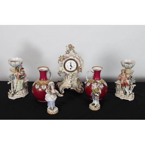 306 - A COLLECTION OF CHINA to include a porcelain flower encrusted clock with enamel dial and Roman numer... 