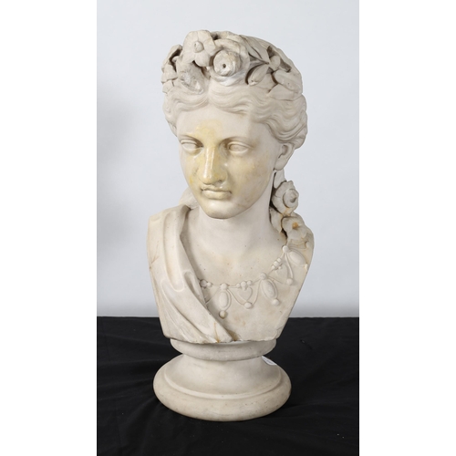 310 - JOHN LAWLOR IRISH (1820-1901)
A white marble bust of a female her tied hair in a bun with floral bou... 