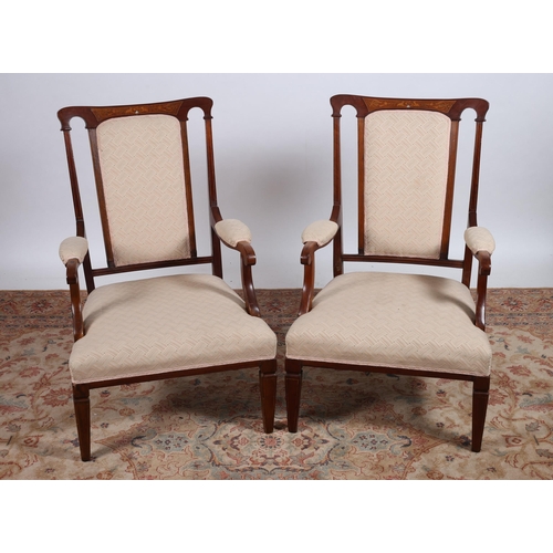 32 - A PAIR OF VINTAGE MAHOGAY INLAID AND UPHOLSTERED ARMCHAIRS each with a shaped top rail with inlaid p... 