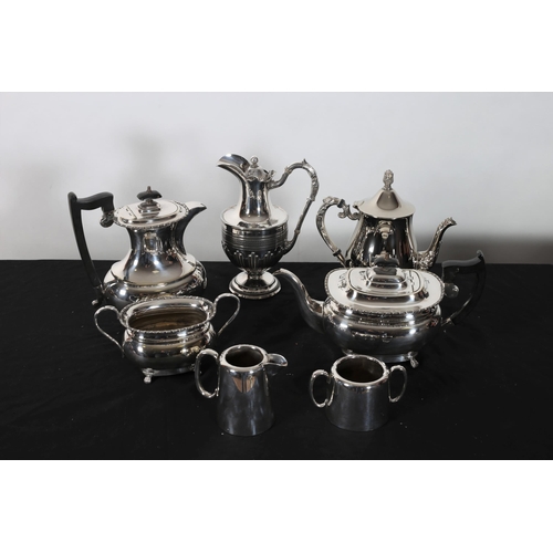 321 - A THREE PIECE SILVER PLATED TEA AND COFFEE SERVICE together with a Hotel ware cream jug and sugar bo... 