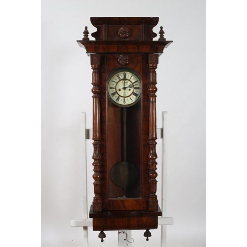 325 - A VINTAGE ROSEWOOD AND STAINED WOOD VIENNA CLOCK the rectangular case with arched glazed door betwee... 