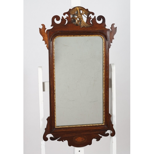 348 - A GEORGIAN DESIGN MAHOGANY AND PARCEL GILT FRET FRAME MIRROR the shaped plate within a moulded frame... 