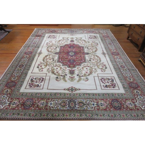 355 - A WOOLMARK BLEND RUG the beige, wine and light green ground with central panel filled with flowerhea... 