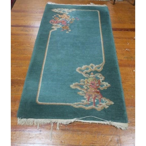 362 - A LIGHT GREEN AND BEIGE GROUND PATTERN WOOL RUG 160cm (l) x 91cm (w) 
together with LIGHT GREEN GROU... 