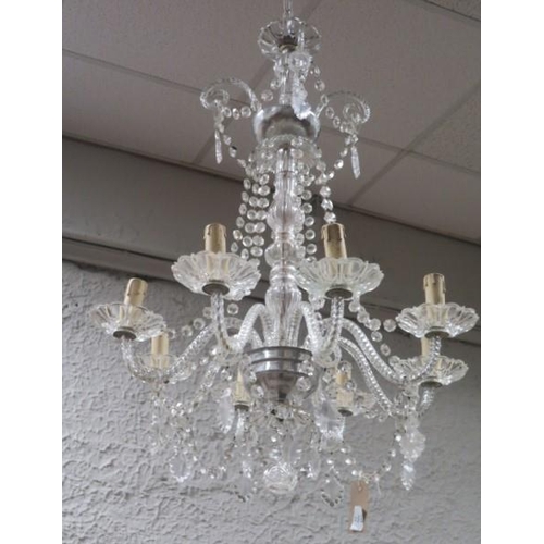 369 - A BOHEMIAN EIGHT BRANCH CUT GLASS CHANDELIER hung with faceted chains and pendants 90cm (drop)