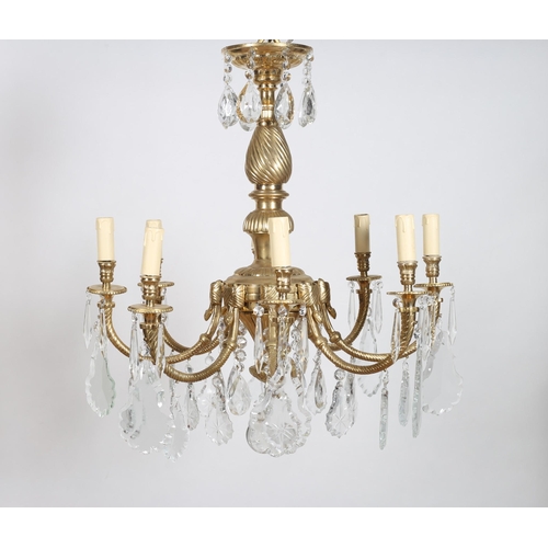 383 - A CONTINENTAL GILT BRASS AND CUT GLASS EIGHT BRANCH CHANDELIER the spiral twist and lobed column iss... 